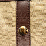 CHANEL Top Handle Turn Lock Coated Canvas Tote in Beige